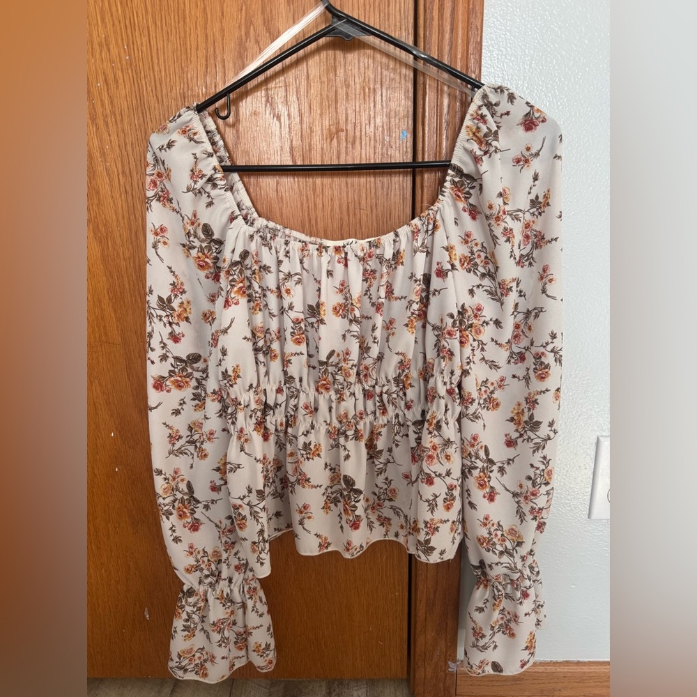 Wild Love size medium, scoop neck, long sleeve with ruffle, cream/orange flowers